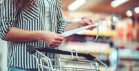 Woman with a shopping cart at the store