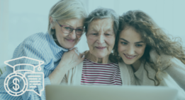 Three generations of women looking at a laptop