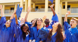 Graduates tossing their caps in the air