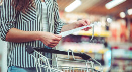 Woman with a shopping cart at the store