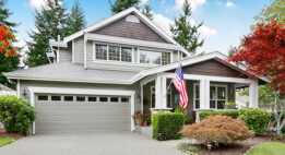 View of a nice house from the end of the driveway