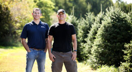 A banker standing next to their client in the outdoors