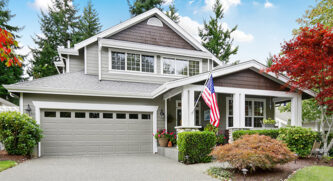 View of a nice house from the end of the driveway