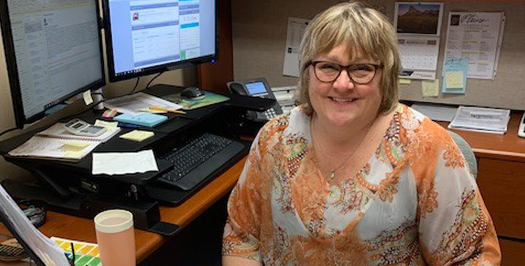 Joyful banker at their desk